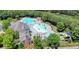 Aerial view of the community pool and clubhouse with waterslide and lake at 302 Grant Ct, Canton, GA 30114