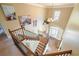 Bright foyer featuring hardwood floors, staircase with wood and iron railings, and chandelier at 302 Grant Ct, Canton, GA 30114