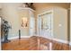 Spacious entry foyer with hardwood floors, natural light, and a unique decorative statue at 302 Grant Ct, Canton, GA 30114
