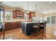 A kitchen featuring granite counters, a center island with seating, and ample natural light at 302 Grant Ct, Canton, GA 30114