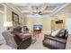 Comfortable living room featuring a stone fireplace, coffered ceiling, and ample seating at 302 Grant Ct, Canton, GA 30114