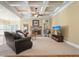 Relaxing living room featuring a fireplace, coffered ceiling, and a view of the breakfast nook at 302 Grant Ct, Canton, GA 30114