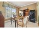 Bright office with a large window, built-in shelving, and a classic desk setup at 302 Grant Ct, Canton, GA 30114