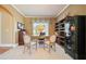 Cozy office with plush carpet, built-in shelving, a large window, and a comfortable workspace at 302 Grant Ct, Canton, GA 30114