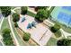 Aerial view of a playground with slides, climbing structures, and landscaping, surrounded by green space and trees at 302 Grant Ct, Canton, GA 30114