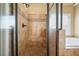 Tiled shower with glass door, bench seating, and separate soaking tub at 302 Grant Ct, Canton, GA 30114