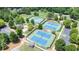 Aerial view of three tennis courts and a clubhouse in a community setting at 302 Grant Ct, Canton, GA 30114