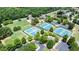 Aerial view of tennis courts and lush green space in the community at 302 Grant Ct, Canton, GA 30114