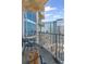 Balcony with chairs and stunning city views of surrounding buildings at 400 W West Peachtree Nw St, Atlanta, GA 30308