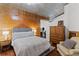 Bedroom featuring hardwood floors, a modern bed, and stylish wall accents at 400 W West Peachtree Nw St, Atlanta, GA 30308