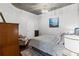 Cozy bedroom with hardwood floors, a modern light fixture, and a comfortable bed at 400 W West Peachtree Nw St, Atlanta, GA 30308
