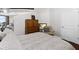 Bedroom showcases hardwood floors, a gray bed, and an armchair at 400 W West Peachtree Nw St, Atlanta, GA 30308