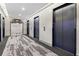 View of the condo's elevator lobby with carpet and multiple elevator doors at 400 W West Peachtree Nw St, Atlanta, GA 30308