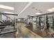 Modern condo gym featuring treadmills and weight machines at 400 W West Peachtree Nw St, Atlanta, GA 30308