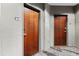 Hallway featuring unit doors and neutral colored walls at 400 W West Peachtree Nw St, Atlanta, GA 30308