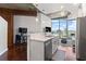 Modern kitchen features a breakfast bar, stainless steel appliances, and open concept layout with city views at 400 W West Peachtree Nw St, Atlanta, GA 30308