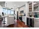 Contemporary kitchen with stainless steel appliances, white cabinets, and breakfast bar overlooking the city at 400 W West Peachtree Nw St, Atlanta, GA 30308