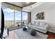 Contemporary living room with stylish decor and large windows overlooking the city at 400 W West Peachtree Nw St, Atlanta, GA 30308