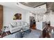 Bright living room features an open kitchen, comfortable seating, hardwood floors, and modern decor at 400 W West Peachtree Nw St, Atlanta, GA 30308
