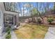 Newly sodded backyard with patio and landscaped hillside at 1291 Briarwood Ne Rd, Brookhaven, GA 30319