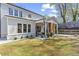 Beautiful backyard featuring a covered patio, new sod and a landscaped yard at 1291 Briarwood Ne Rd, Brookhaven, GA 30319