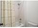 Bathroom with a tub and shower combination, featuring decorative shower curtain, and chrome fixtures at 1291 Briarwood Ne Rd, Brookhaven, GA 30319