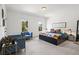 Spacious bedroom with seating area, large windows, and stylish décor at 1291 Briarwood Ne Rd, Brookhaven, GA 30319