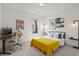 Bright bedroom with decor, an office space, and a large window looking out to the yard at 1291 Briarwood Ne Rd, Brookhaven, GA 30319