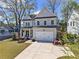 Charming two-story home with a well-manicured front yard and a two car garage at 1291 Briarwood Ne Rd, Brookhaven, GA 30319