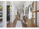 Elegant foyer with hardwood floors, a console table, and views of the staircase at 1291 Briarwood Ne Rd, Brookhaven, GA 30319
