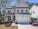 Beautiful two-story home featuring a two-car garage and well-manicured landscaping at 1291 Briarwood Ne Rd, Brookhaven, GA 30319