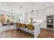 A modern eat-in kitchen features stainless appliances, a kitchen island with seating and hardwood floors at 1291 Briarwood Ne Rd, Brookhaven, GA 30319