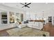 Bright, open living area with a fireplace, leading into the modern kitchen with a spacious sectional and natural lighting at 1291 Briarwood Ne Rd, Brookhaven, GA 30319