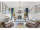 Stylish living room with unique decor, modern lighting, comfortable seating, and an abundance of natural light at 1291 Briarwood Ne Rd, Brookhaven, GA 30319