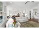 Bright and airy living room with modern furnishings open to eat-in kitchen and hardwood floors at 1291 Briarwood Ne Rd, Brookhaven, GA 30319