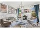 Chic living room featuring curated art, designer furnishings, ample natural light, and a refined, stylish ambiance at 1291 Briarwood Ne Rd, Brookhaven, GA 30319