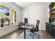 Bright home office with a large window, built-in shelving and modern furnishings at 1291 Briarwood Ne Rd, Brookhaven, GA 30319