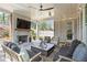 Relaxing covered outdoor patio area featuring a fireplace and comfortable seating for entertaining at 1291 Briarwood Ne Rd, Brookhaven, GA 30319