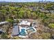 Aerial image of a community pool area with a pool house surrounded by trees at 1291 Briarwood Ne Rd, Brookhaven, GA 30319