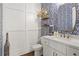 Stylish powder room with decorative wallpaper, modern fixtures, and a custom vanity at 1291 Briarwood Ne Rd, Brookhaven, GA 30319
