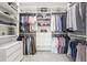 A large walk-in closet with custom shelving, multiple hanging racks, and built-in storage drawers at 1291 Briarwood Ne Rd, Brookhaven, GA 30319