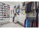 Spacious walk-in closet with custom shelving, shoe racks and ample storage space at 1291 Briarwood Ne Rd, Brookhaven, GA 30319