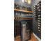 Elegant wine cellar with custom shelving, storage, and a wine refrigerator to properly cellar your wine collection at 1291 Briarwood Ne Rd, Brookhaven, GA 30319