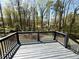 Wooden backyard deck overlooking wooded backyard area at 2919 Manitoba Ln, Marietta, GA 30062