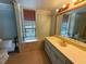 Bathroom with large vanity, mirror, and a window that provides natural light at 2919 Manitoba Ln, Marietta, GA 30062