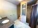 Bathroom featuring a stand-up shower and a single sink vanity, complete with granite countertop at 2919 Manitoba Ln, Marietta, GA 30062