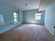 This bedroom has carpet floors, ample sunlight, and neutral paint throughout at 2919 Manitoba Ln, Marietta, GA 30062