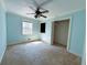 Bedroom featuring neutral walls, carpet, a ceiling fan, and a closet at 2919 Manitoba Ln, Marietta, GA 30062