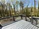 Lovely gray deck overlooking a wooded backyard with mature trees creating a serene and private outdoor space at 2919 Manitoba Ln, Marietta, GA 30062