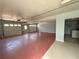 Three car garage with painted floor, interior door, and overhead lighting at 2919 Manitoba Ln, Marietta, GA 30062